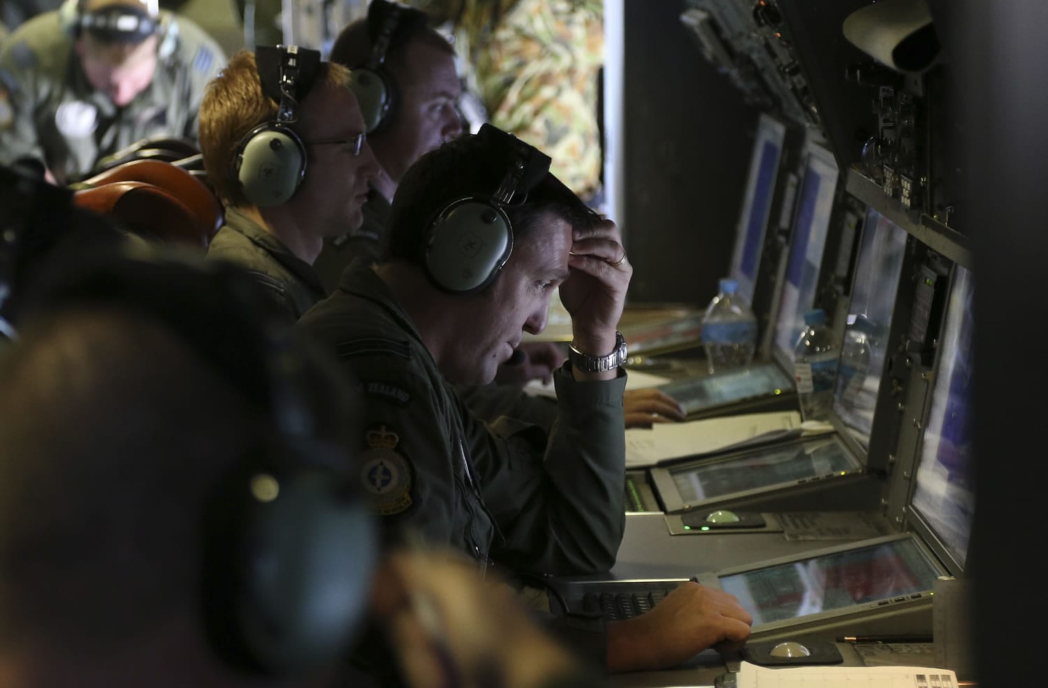 Operators monitor TAC stations onboard a Royal New Zealand Air Force P3 Orion on Friday during search operations for wreckage and debris of missing Malaysia Airlines Flight MH370 in the southern Indian Ocean, near the coast of Western Australia.