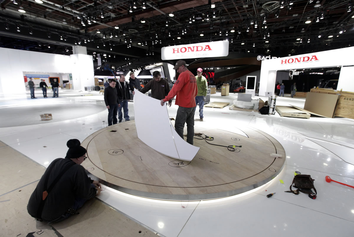 Workers set up the Honda exhibit Thursday for the upcoming North American International Auto Show in Detroit. The show opens to the media Monday at the Cobo Center in Detroit. The public show opens Jan.