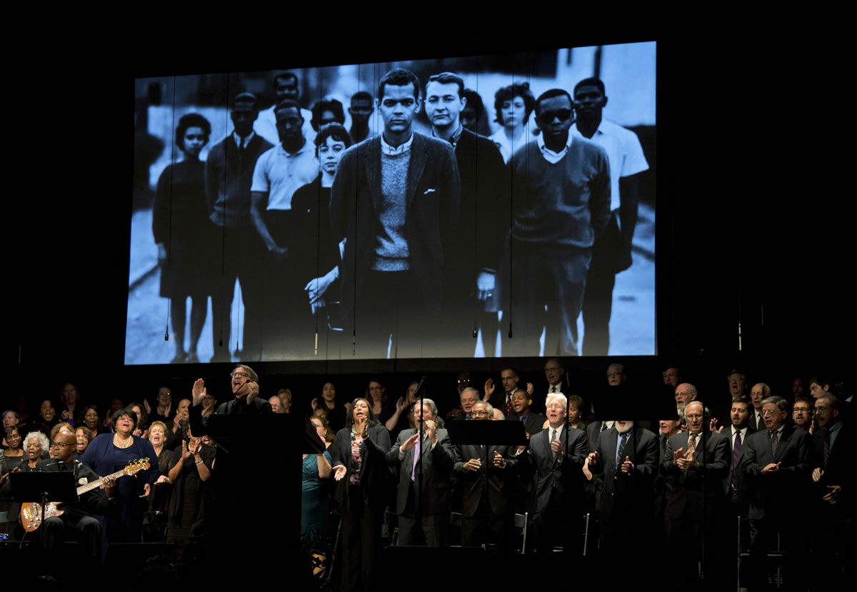 A choral group performs Tuesday during the memorial service for the late civil rights leader Julian Bond at the Lincoln Theater in Washington.