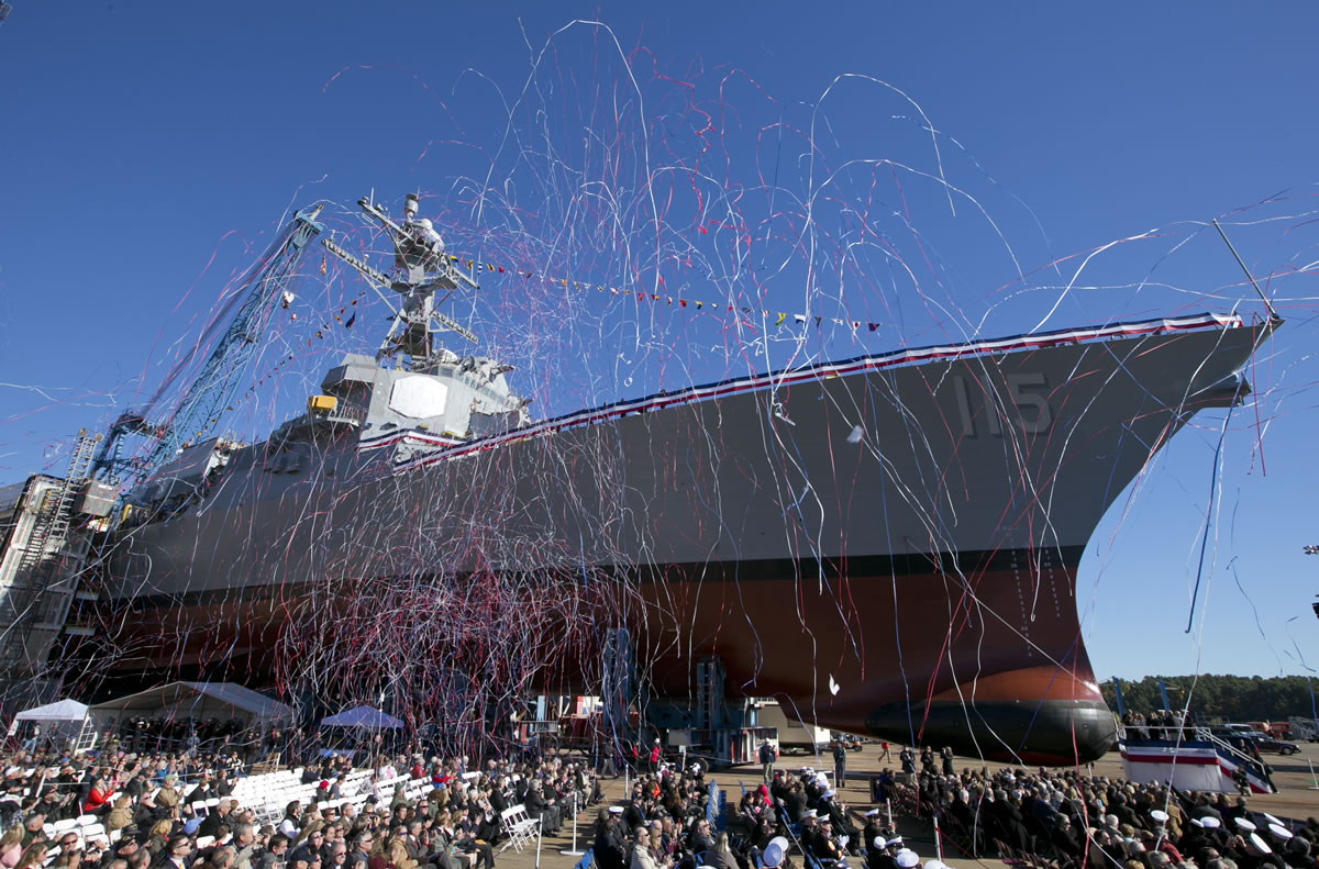 Streamers fly during the christening of the USS Rafael Peralta on Saturday in Bath, Maine. The ship is named for a Marine who was killed in action in Iraq on Nov. 15, 2004. (Photos by ROBERT F.