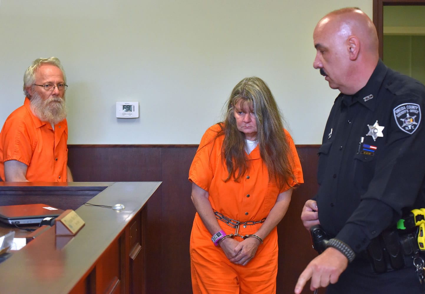 Bruce Leornard and Deborah Leonard enter the courtroom before their arraignment Tuesday in New Hartford, N.Y.