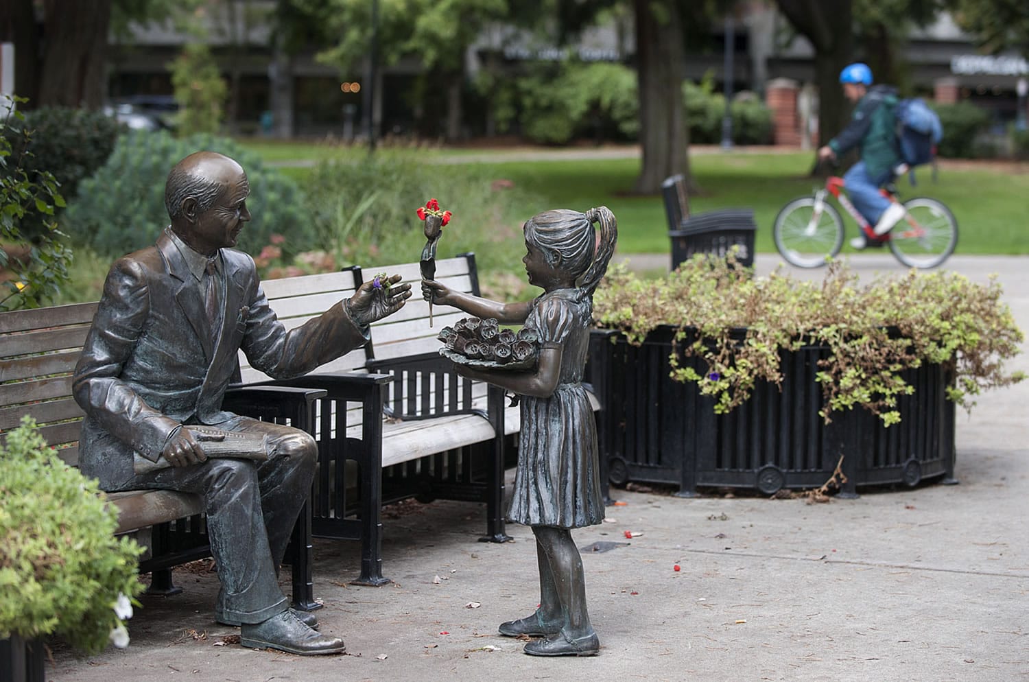 The Columbian's history is intertwined with the community that it has served for 125 years. A statue in Esther Short Park, Vancouver's outdoor living room, reflects the relationship between the newspaper and its community in depicting a man with a copy of The Columbian on his lap  as he greets a young girl.