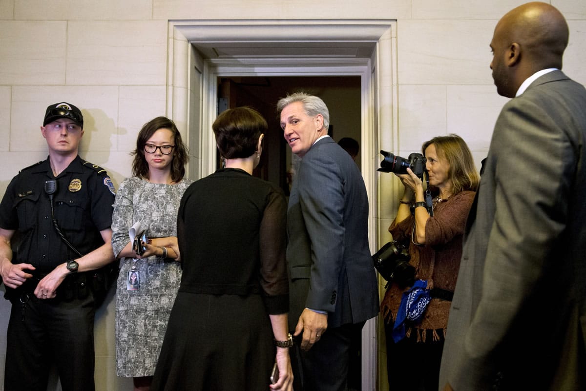House Majority Leader Kevin McCarthy of Calif., center, turns to his wife Judy McCarthy as they enter a House Republican caucus vote on its nominee to replace House Speaker John Boehner on Thursday on Capitol Hill in Washington.