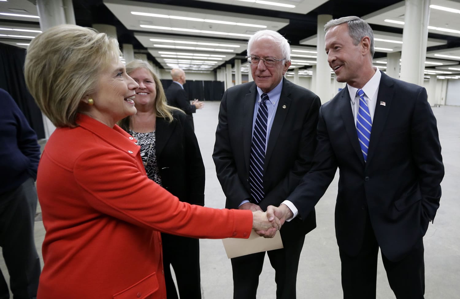 Democratic presidential candidates Hillary Rodham Clinton, from left, Sen. Bernie Sanders, I-Vt., and former Maryland Gov. Martin O&#039;Malley talk backstage before the start of the Iowa Democratic Party&#039;s Jefferson-Jackson Dinner, Saturday in Des Moines, Iowa.