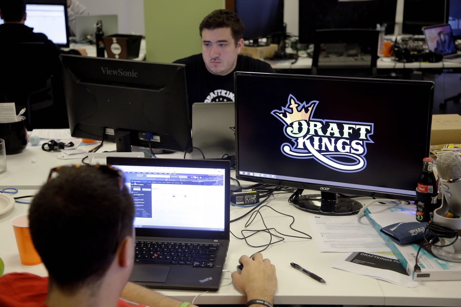 Len Don Diego, marketing manager for content at DraftKings, a daily fantasy sports company, works at his station at the company&#039;s offices in Boston.