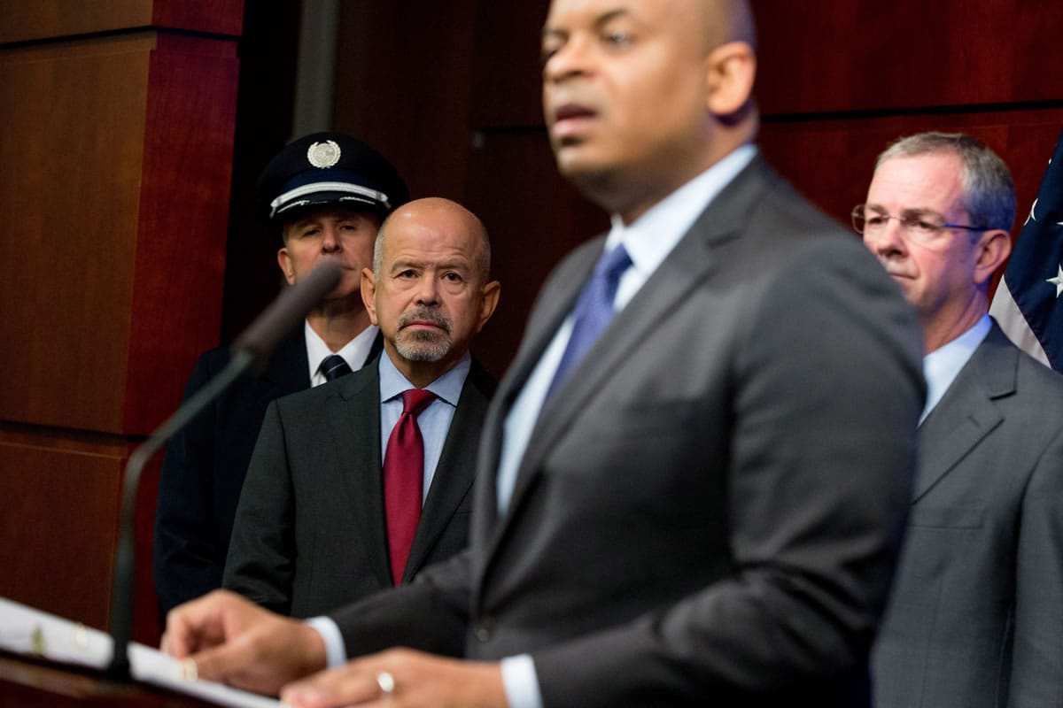 FAA Administrator Michael Huerta, second from left, and others, listen as Transportation Secretary Anthony Foxx, second from right, speaks during a news conference at the Transportation Department in Washington on Monday where he announced the creation of a task force to develop recommendations for a registration process for Unmanned Aircraft Systems.