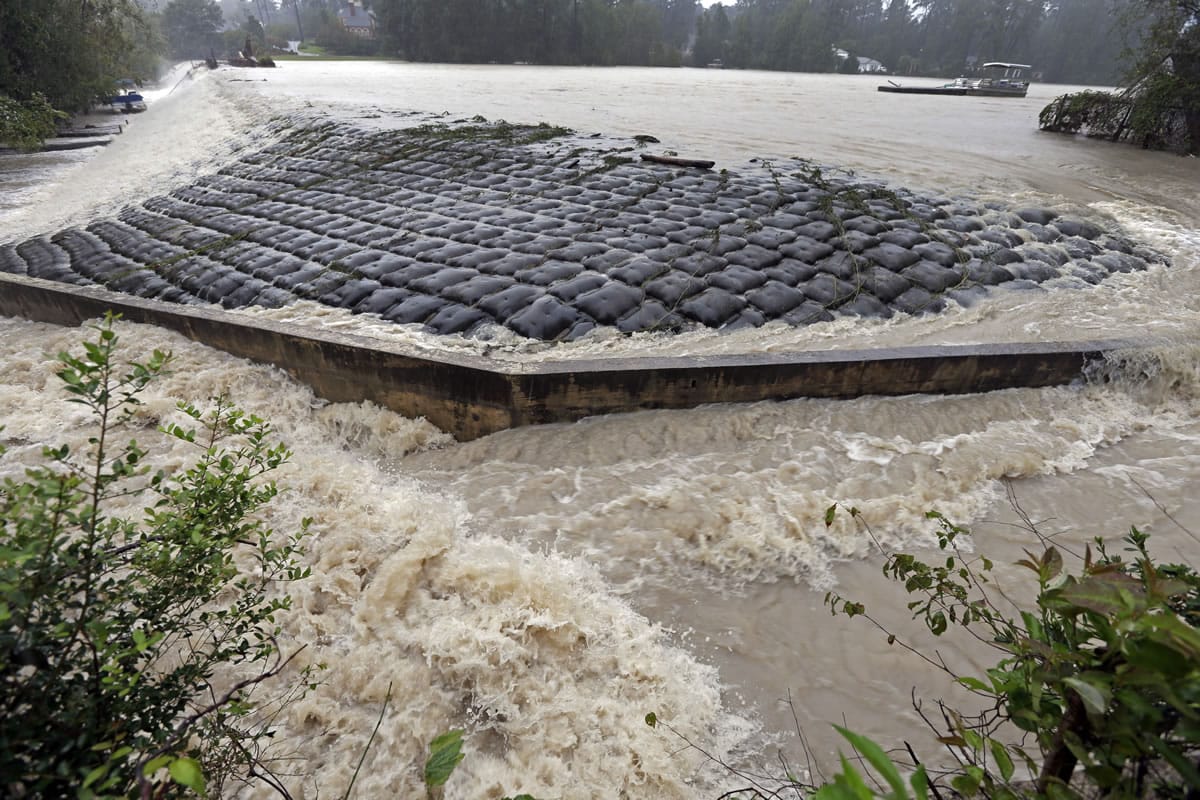 Floodwaters rush over a dam Oct. 4 on Forest Lake in Columbia, S.C. Under a directive from the state Department of Health and Environmental Control, some dam owners are under a Friday, Oct. 30, 2015, deadline to submit plans to repair or replace the structures.