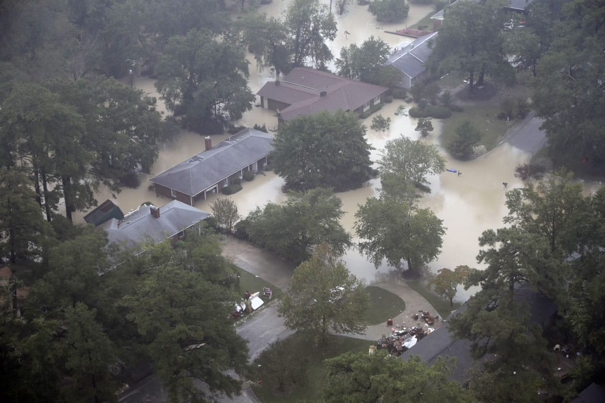 Flooded homes are shown in the Gills Creek area in Columbia, S.C. Over the past week, as the water rose after days of unrelenting rain in the heart of South Carolina, the creek spilled misery and pain on rich and poor alike, robbing both of the things most precious to them.