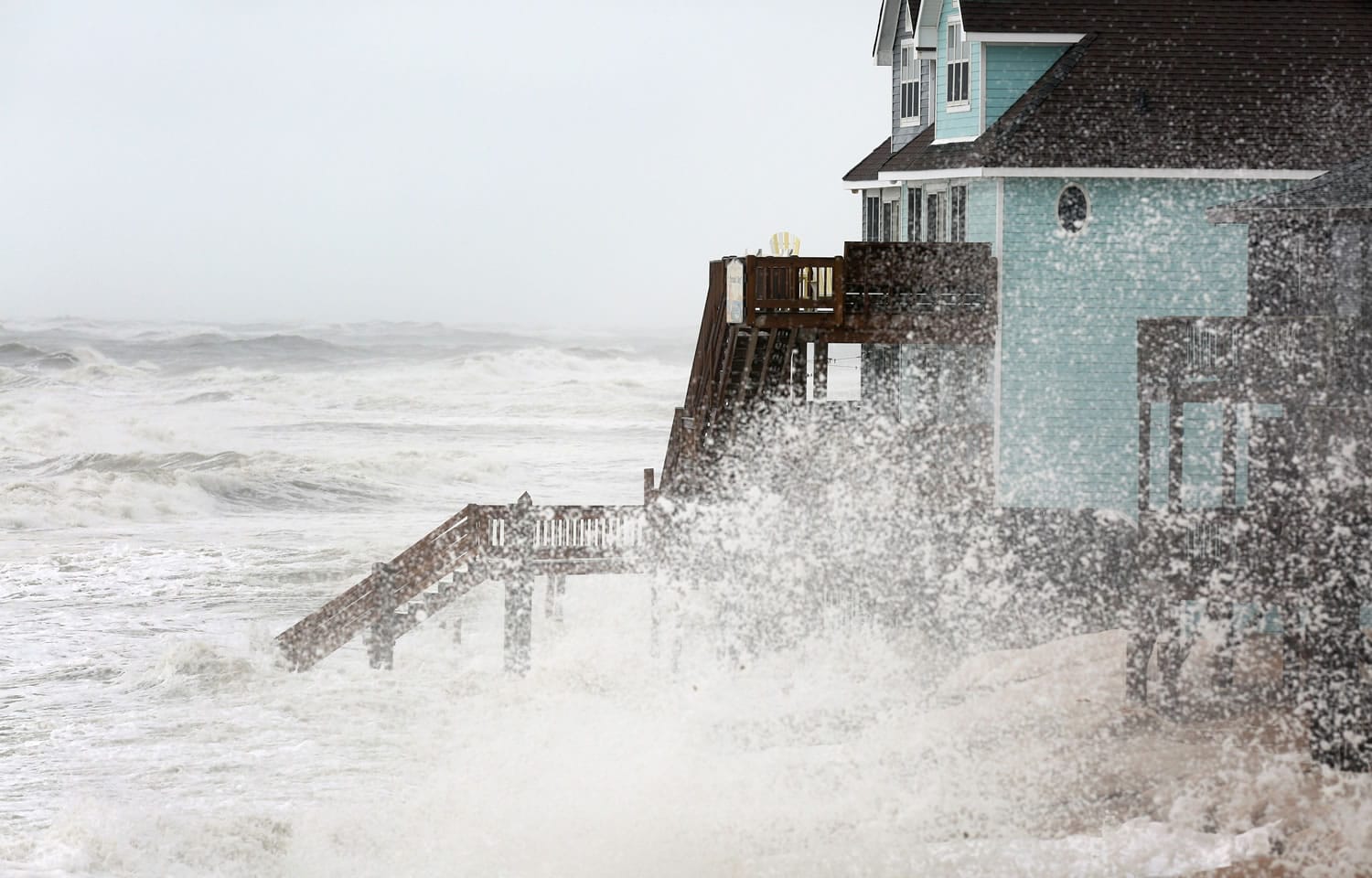 Waves batter the shoreline in Buxton on North Carolina&#039;s Hatteras Island during high tide on Sunday. The Eastern Seaboard appeared to dodge the full fury of Hurricane Joaquin, which is veering out to sea.