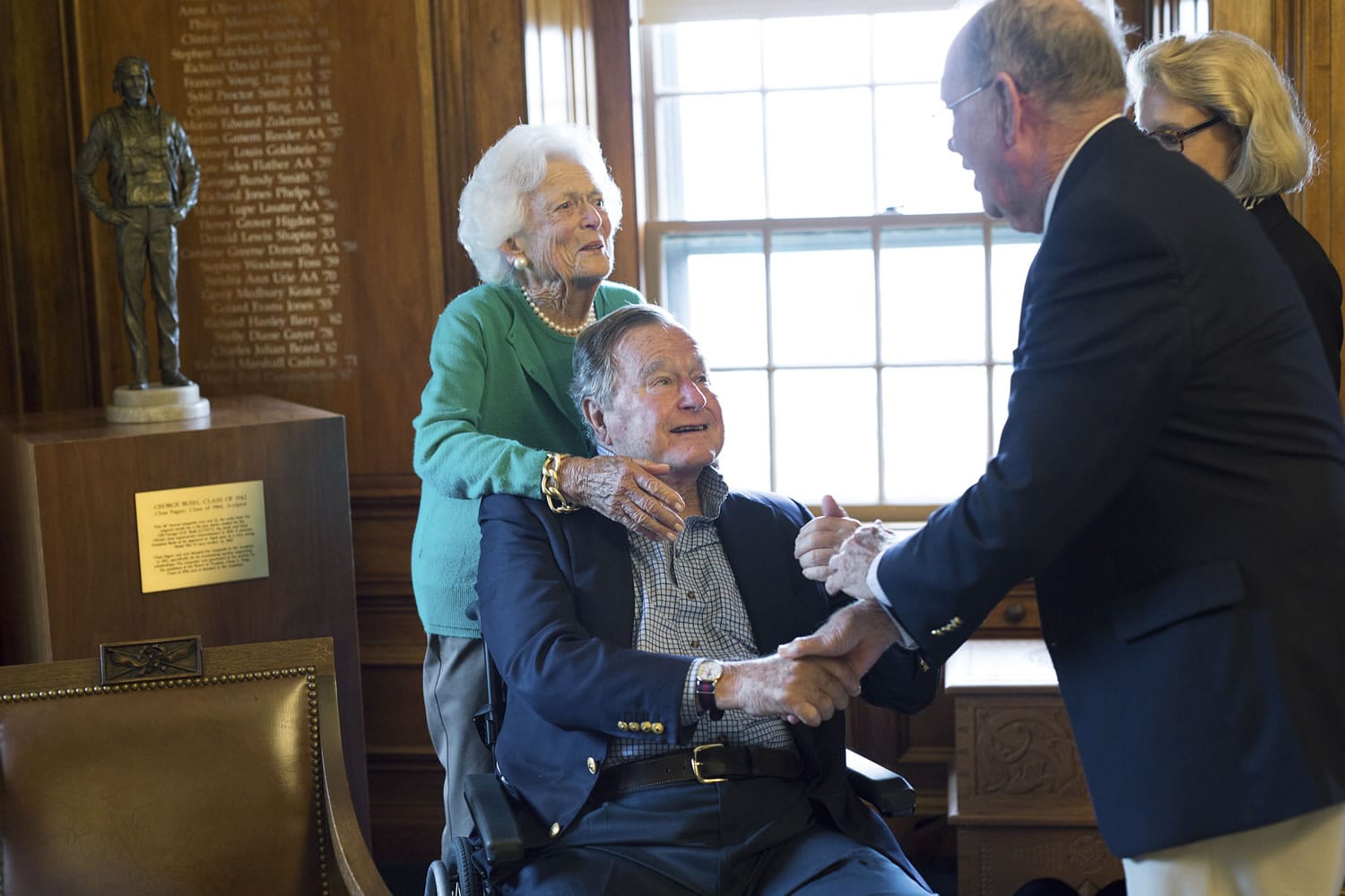 Former President George H.W. Bush, with his wife, Barbara, speaks with former baseball teammate Richard Phelps during a visit to Phillips Academy in Andover, Mass., on Wednesday.