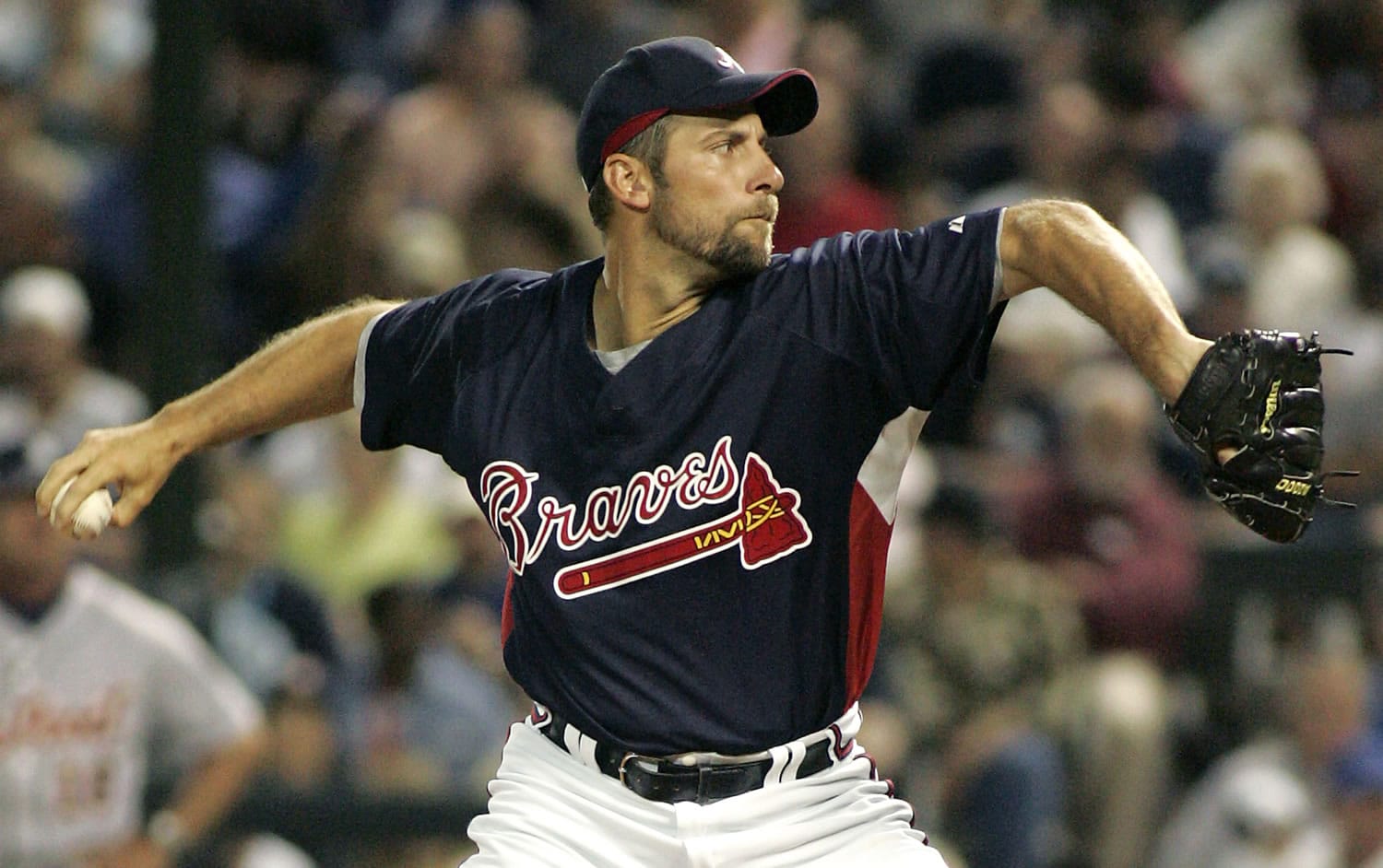 In this March 27, 2007, file photo, Atlanta Braves pitcher John Smoltz throws in the fourth inning of a spring training baseball game against the Detroit Tigers in Lake Buena Vista, Fla.