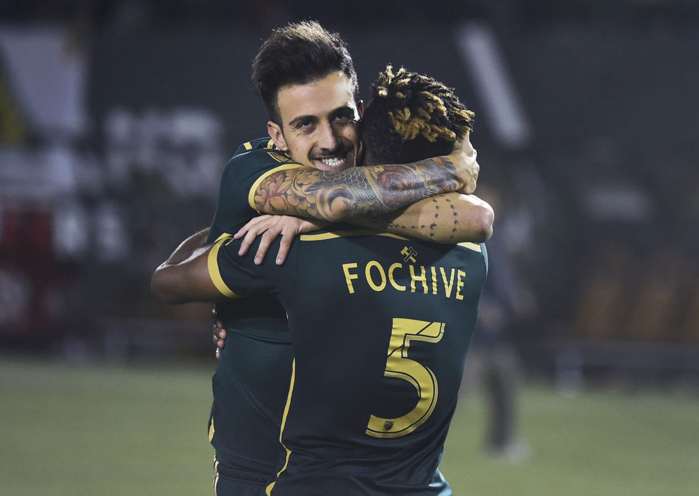 George Fochive (5), pictured celebrating with former Timber Maxi Urruti, on Tuesday was transferred to Viborg FF in Denmark, ending two years in Portland for the young midfielder.