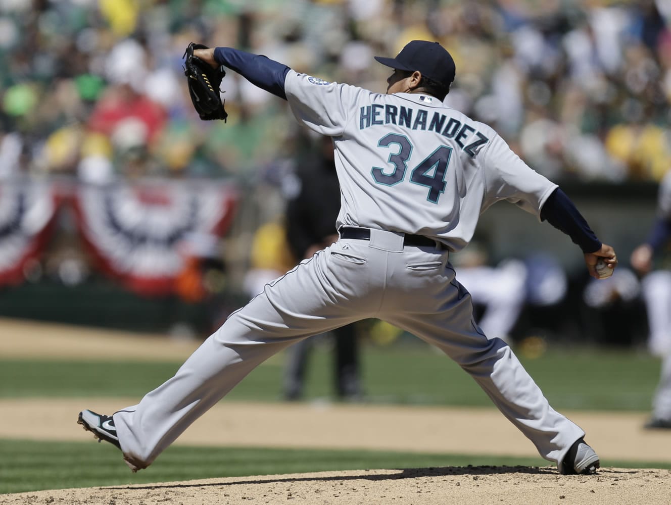 Seattle Mariners' Felix Hernandez retired the first 11 batters on the way to his 16th career win over the Athletics. The Mariners won 3-1 Saturday.