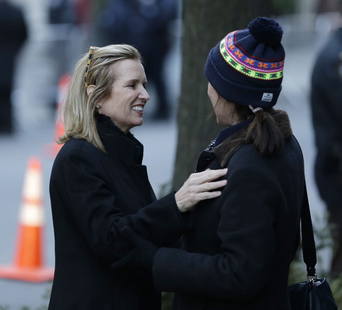 Kerry Kennedy, former wife of New York Governor Andrew Cuomo, greets an unidentified woman outside the wake for Mario Cuomo in New York on Monday.