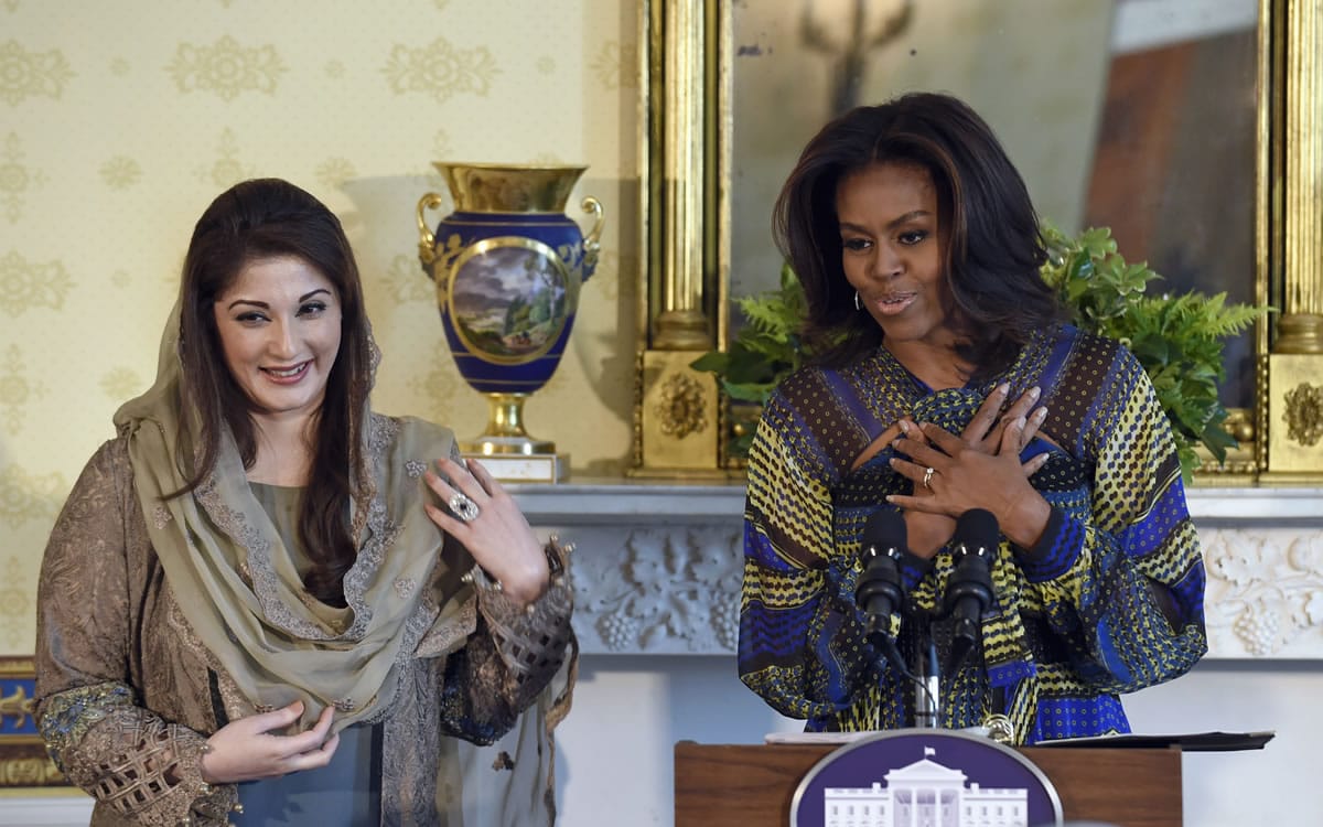 First lady Michelle Obama stands with Mariam Safdar, daughter of Pakistani Prime Minister Nawaz Sharif, as she speaks during an event Thursday at the White House. Obama announced a new partnership to further girls&#039; education in Pakistan.