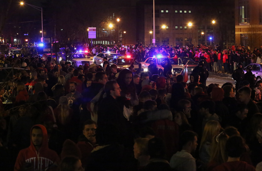 Ohio State students celebrate, early Tuesday on High Street in Columbus, Ohio, following their team's win in the NCAA National Championship football game against Oregon.