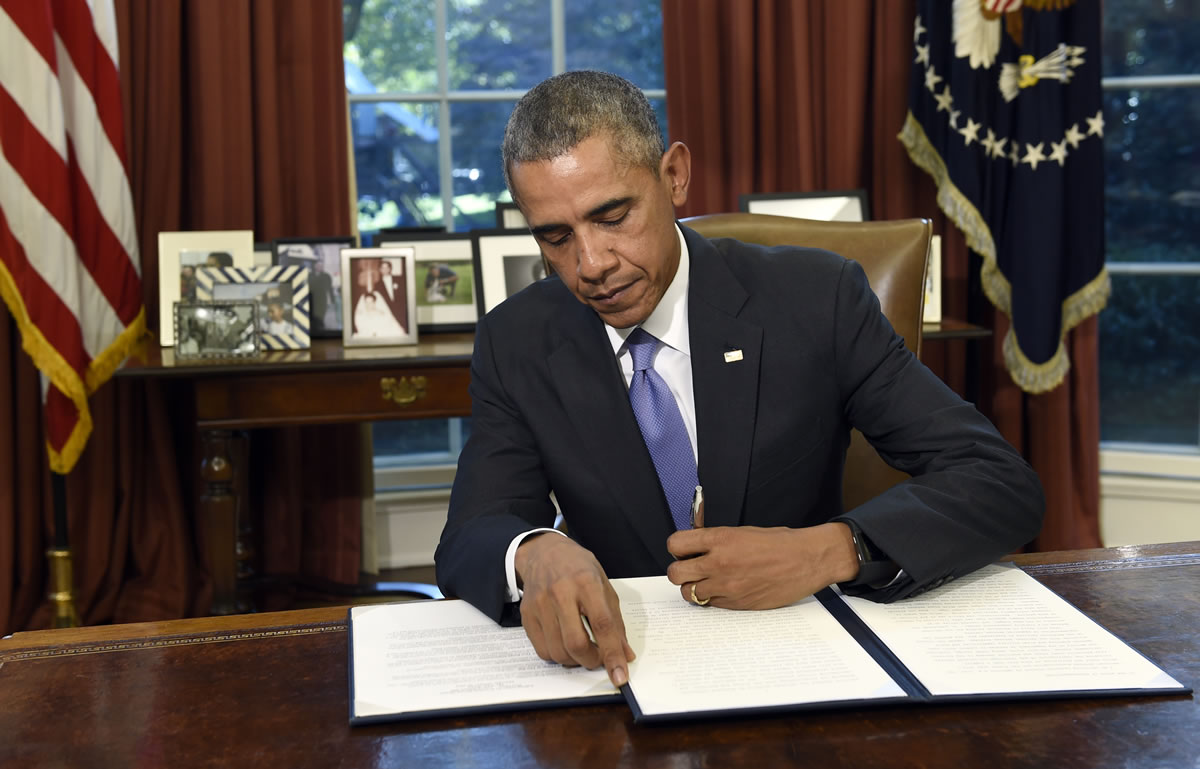 President Barack Obama vetoes the National Defense Authorization Act on Thursday in the Oval Office.