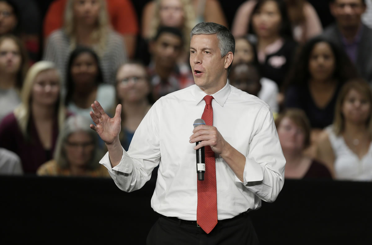 Education Secretary Arne Duncan speaks during a town hall meeting in Des Moines, Iowa.