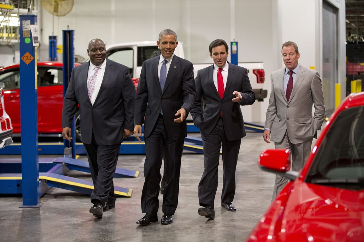 From left, Ford plans manager, Phillip Calhoun, President Barack Obama, Ford President and CEO Mark Fields and Bill Ford eye a new Mustang at Ford Michigan Assembly Plant in Wayne, Mich., where the president spoke Wednesday about the resurgent American automotive and manufacturing sector.