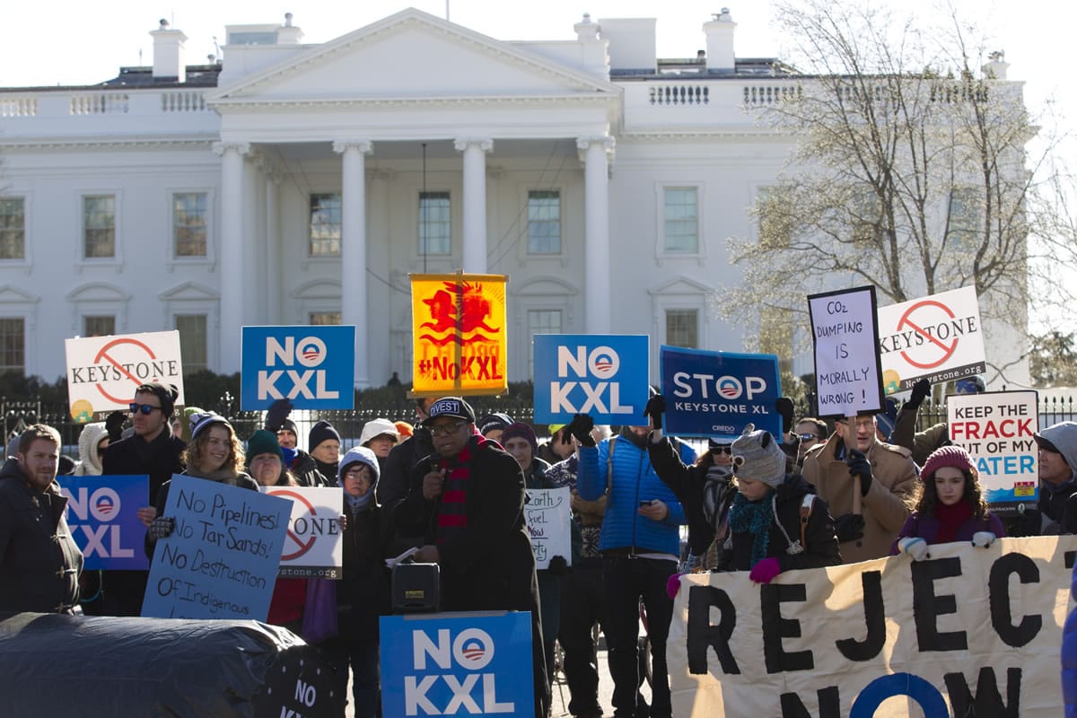 Dozens of demonstrators rally Saturday in support of Obama's pledge to veto any legislation approving the Keystone XL pipeline, outside the White House in Washington.