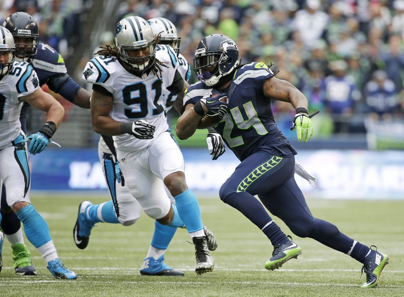 Seattle Seahawks running back Marshawn Lynch rushes against Carolina Panthers' Ryan Delaire (91) in the second half of an NFL football game, Sunday, Oct. 18, 2015, in Seattle.