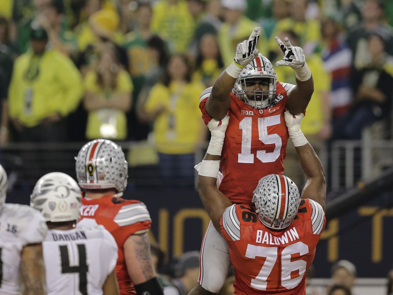 Ohio State running back Ezekiel Elliott (15) celebrates following a touchdown during the second half of the NCAA college football playoff championship game against Oregon Monday, Jan. 12, 2015, in Arlington, Texas.