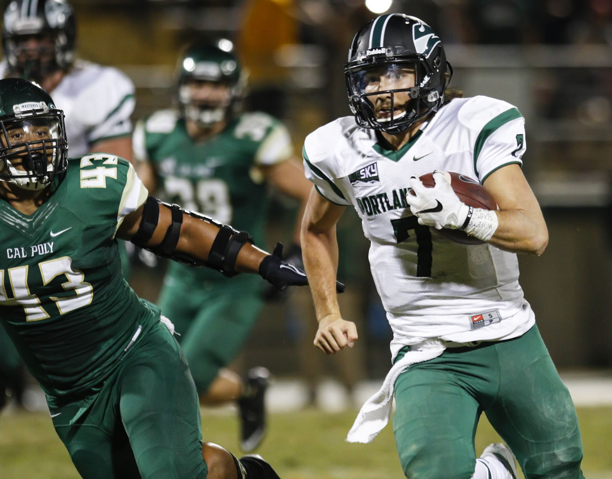 Portland State quarterback Alex Kuresa (7) runs for a touchdown in the first half against Cal Poly during an NCAA college football game Saturday, Oct 24, 2015, in San Luis Obispo, Calif.