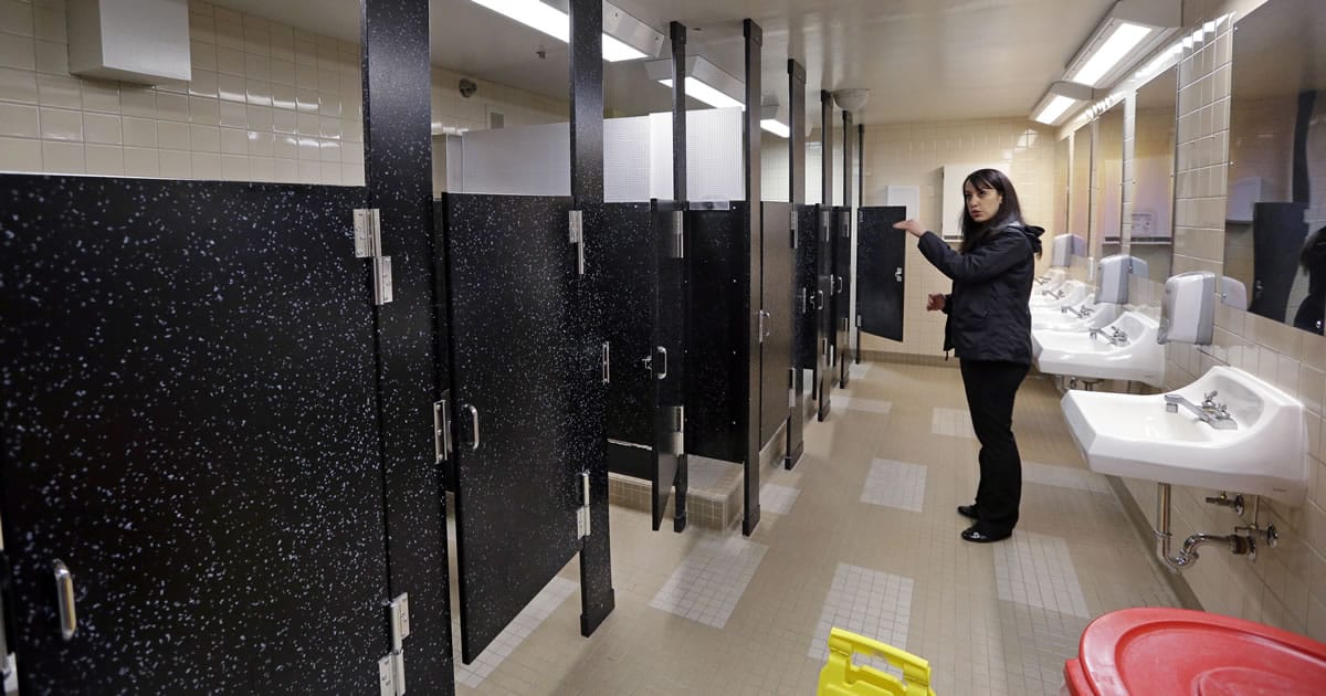 Felice Davis, associate superintendent of programs, explains that the height of restroom stall doors allows some privacy but helps to dissuade illicit activity at the Washington Corrections Center For Women in Gig Harbor.