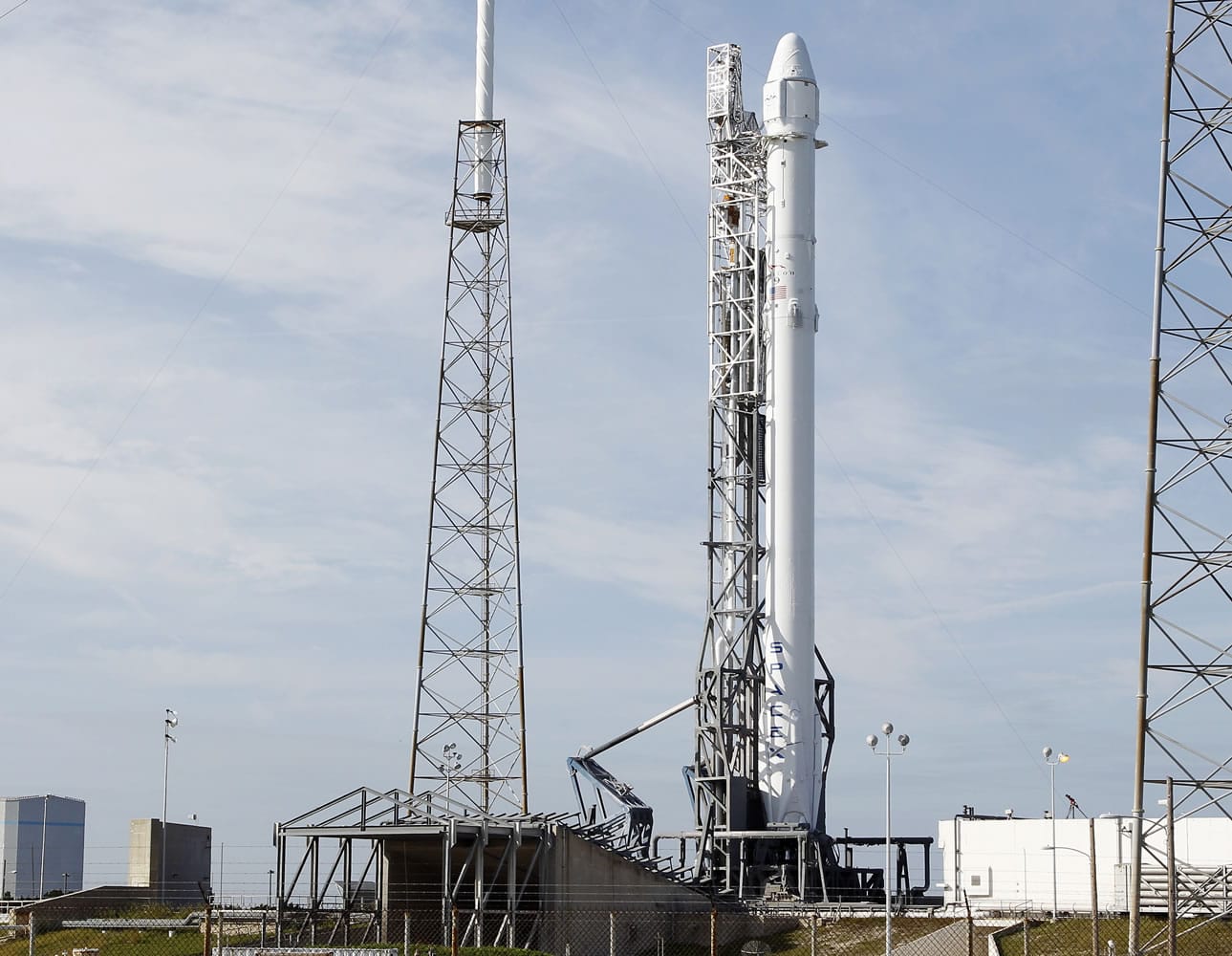 A Falcon 9 rocket carrying the SpaceX Dragon spacecraft is seen at launch complex 40 after an attempted early morning launch was scrubbed due to technical issues at the Cape Canaveral Air Force Station in Cape Canaveral, Fla. on Tuesday, Jan. 6, 2015. The countdown was halted with just over a minute remaining until launch.