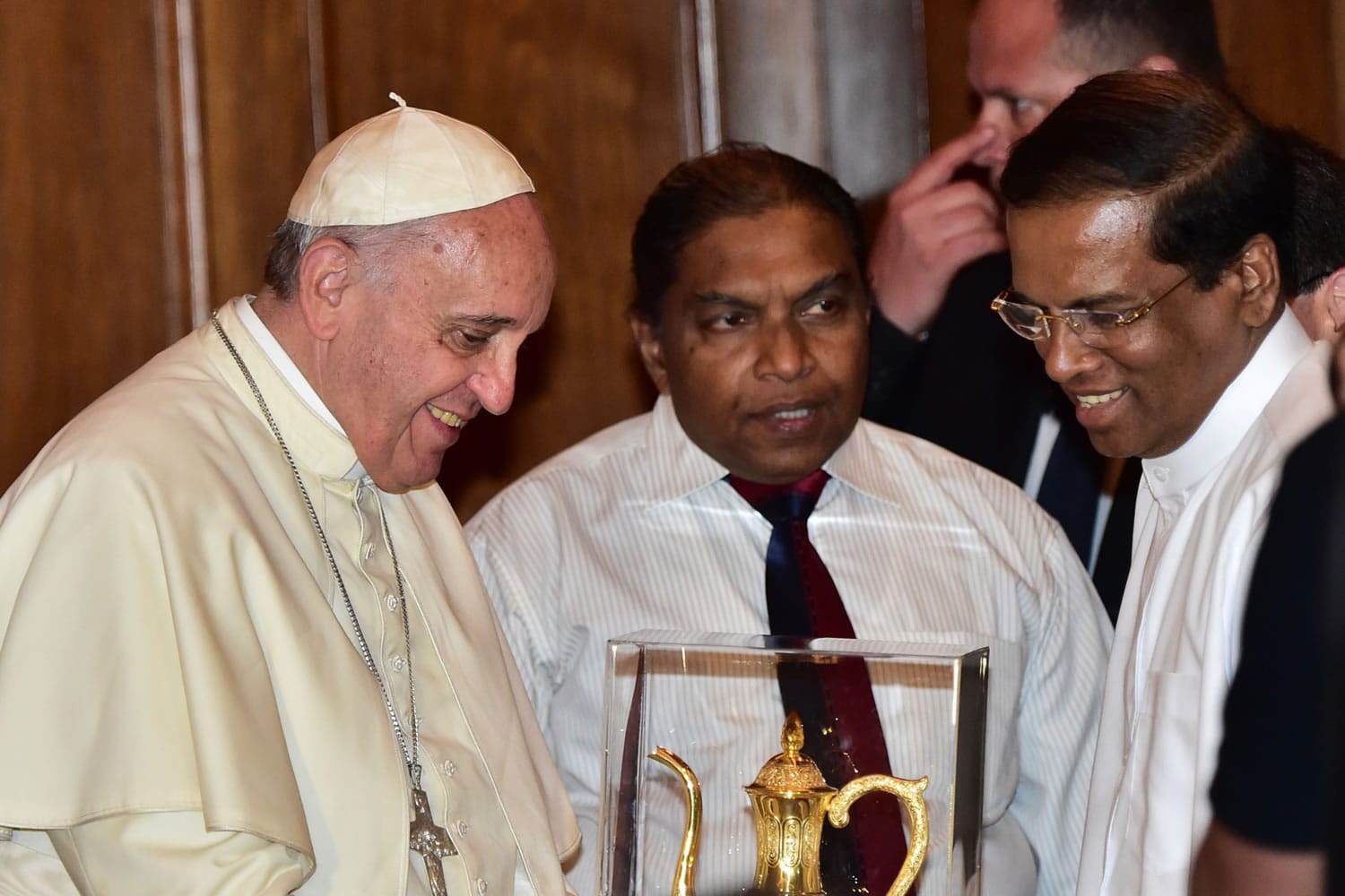 Pope Francis exchanges gifts with newly elected Sri Lankan President Maithripala Sirisena, right, in the Presidential Secretary's office in Colombo, Sri Lanka, on Tuesday.