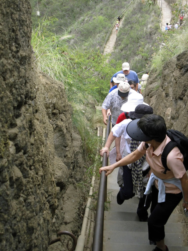 Visitors to Diamond Head tackle the steep 1.6-mile, round-trip trail Feb. 18, 2010, up to the summit on Oahu in Hawaii. Diamond Head, a volcanic crater located at one end of Waikiki on the coast of Oahu, is one of Hawaii&#039;s most famous landmarks as well as one of its most popular tourist attractions.