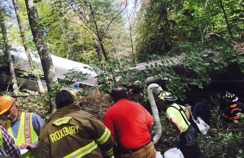 First responders assess the scene of an Amtrak passenger train derailment Monday in Northfield, Vt. The train, the Vermonter, was headed from Vermont to Washington, D.C., when it apparently struck rocks that were on the tracks. No life-threatening injuries were reported.
