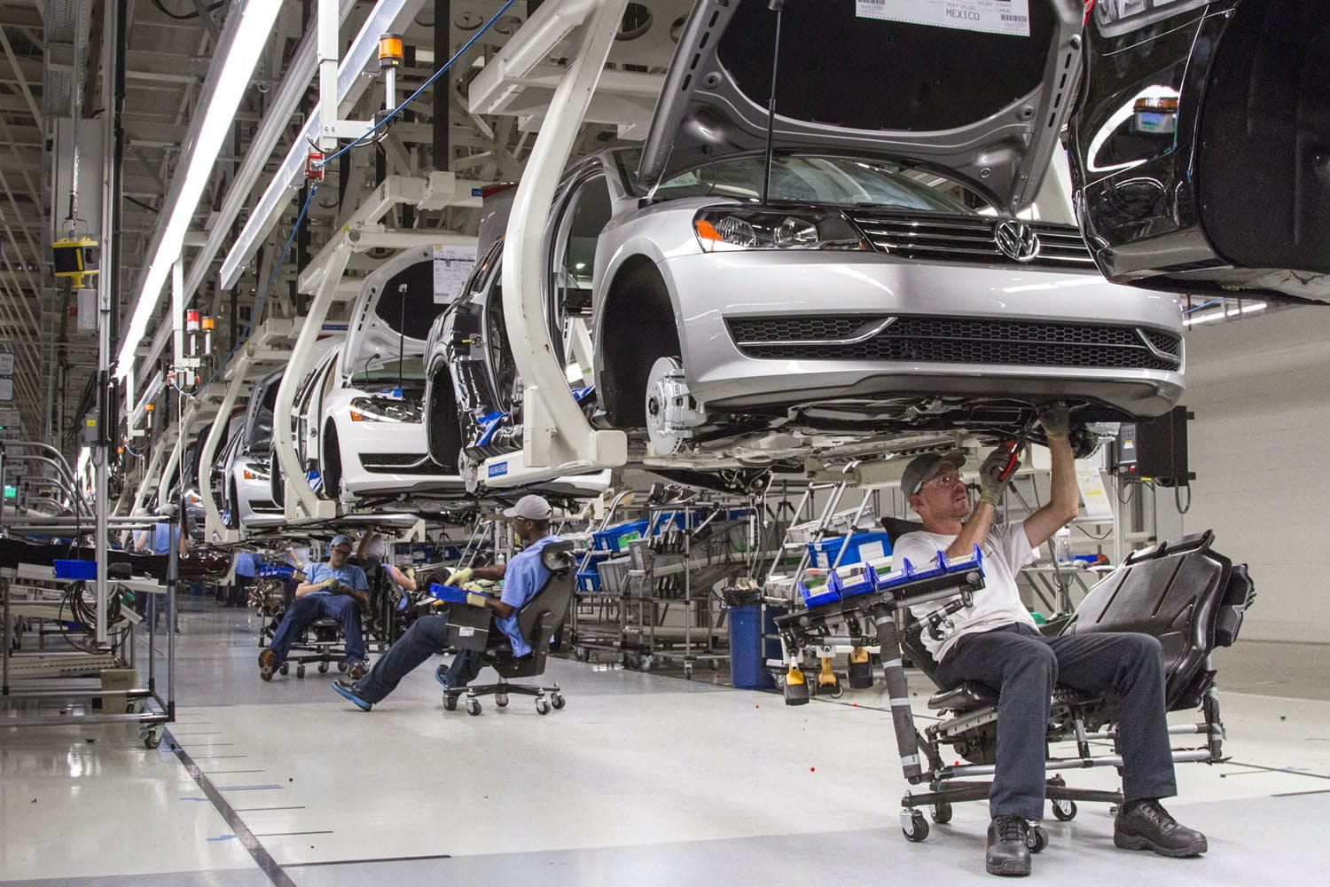 Employees at the Volkswagen plant in Chattanooga, Tenn., work on the assembly of a Passat sedan in 2013.