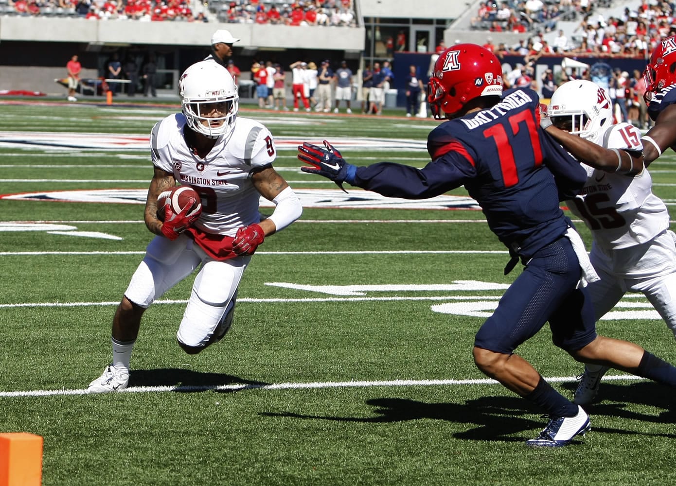 Washington State wide receiver Gabe Marks, left, scores a touchdown in front of Arizona cornerback Jace Whittaker (17) during the first half of an NCAA college football game, Saturday, Oct. 24, 2015, in Tucson, Ariz.