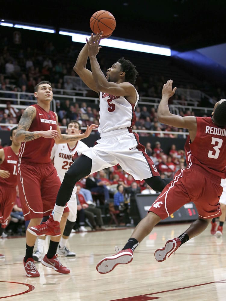 Stanford guard Chasson Randle (5) takes a shot over Washington State center Jordan Railey, left, during the second half Friday, Jan. 2, 2015, in Stanford, Calif. Stanford won 71-56.