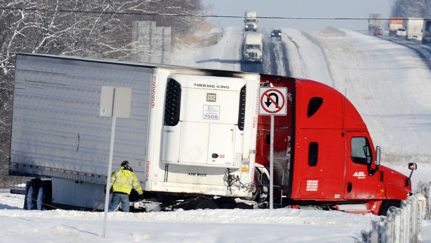 A jack-knifed semitrailer sits in the median near the 260-mile marker on Interstate 69 in Grant County, Ind., on Tuesday.