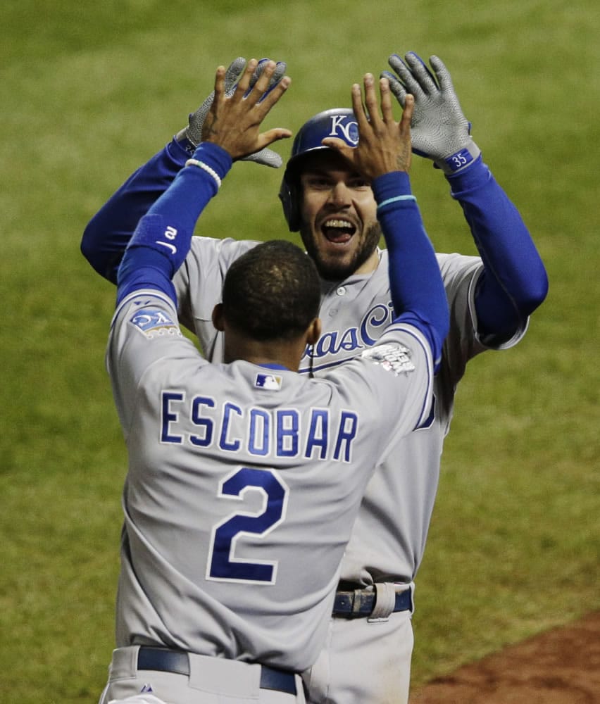 Kansas City Royals&#039; Eric Hosmer celebrates with Alcides Escobar (2) after scoring on an RBI single during the eighth inning of Game 4 of the Major League Baseball World Series against the New York Mets Saturday, Oct. 31, 2015, in New York.