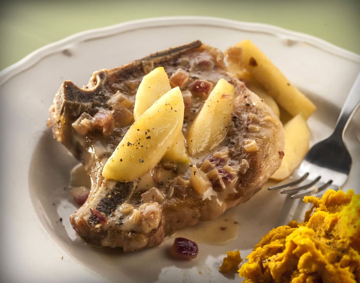 Pork chops paired with apples three ways -- apples, apple cider and applejack -- make a quick, comfort-food dinner.