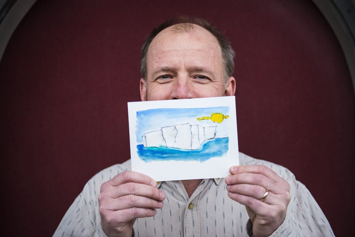 NOAA oceanographer Gregory Johnson holds his watercolor haiku book Jan.