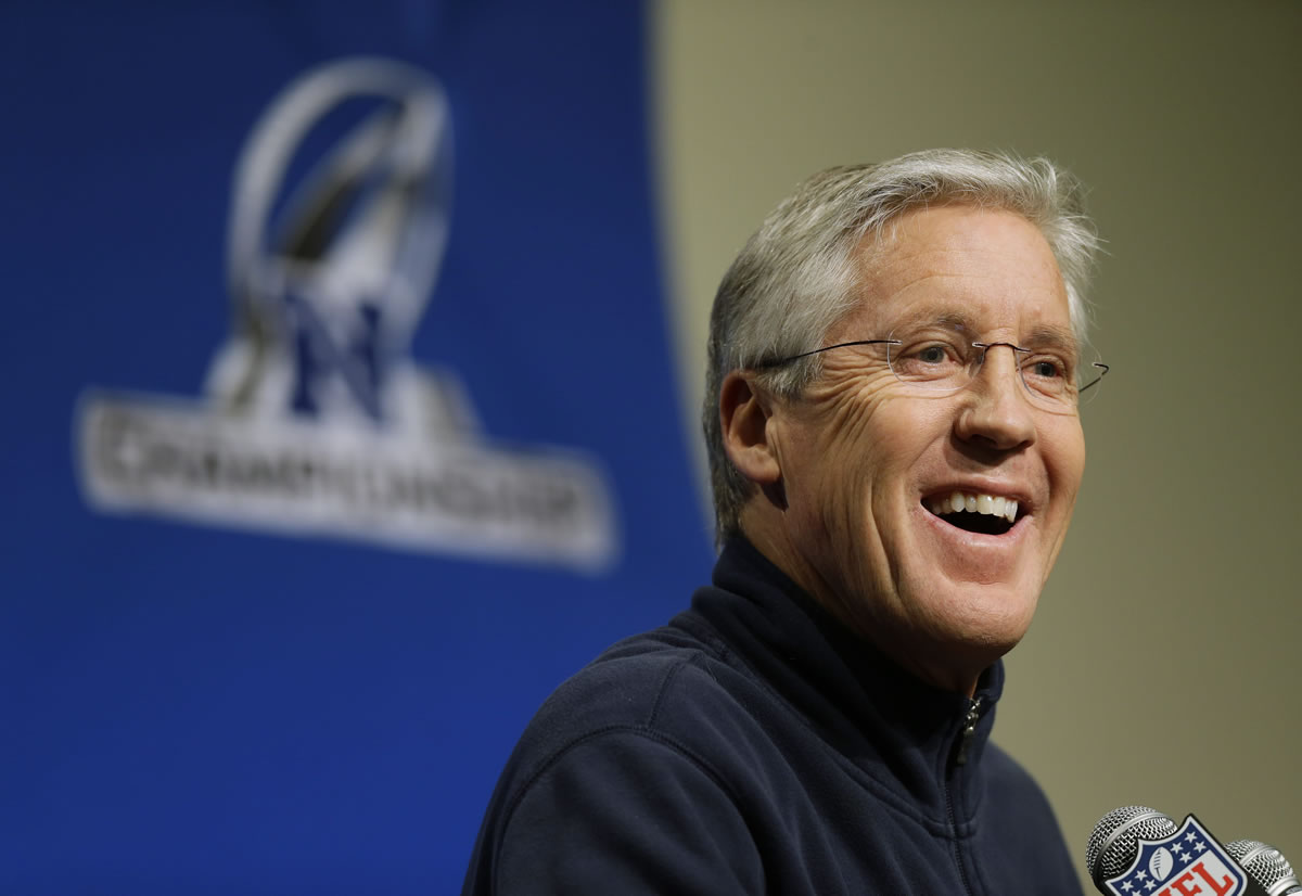 Seattle Seahawks head coach Pete Carroll talks to reporters on Wednesday, Jan. 15, 2014, in Renton, Wash. The Seahawks are to play the San Francisco 49ers on Sunday in the NFL football NFC championship in Seattle. (AP Photo/Ted S.