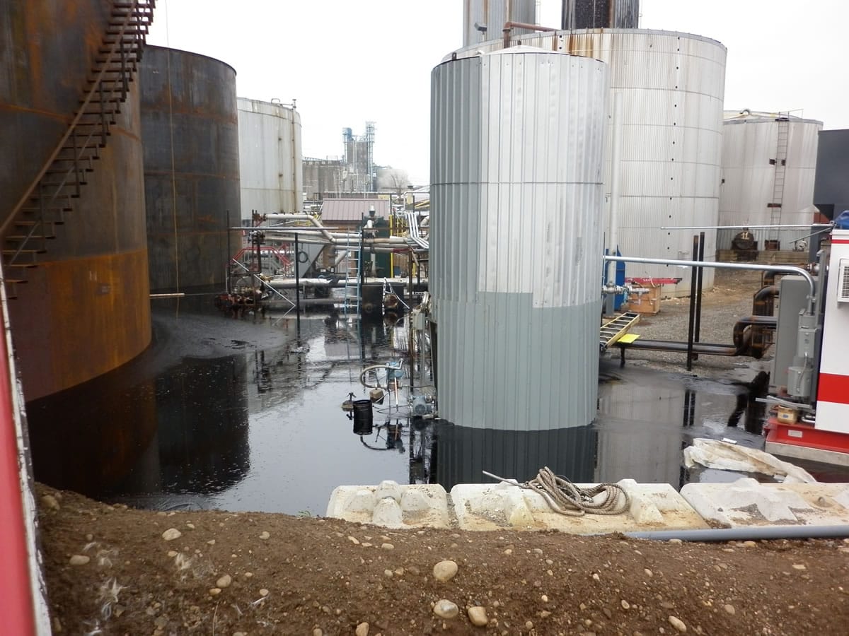 A tank failed at Albina Asphalt, spilling 220,000 gallons of asphalt oil into a containment area.