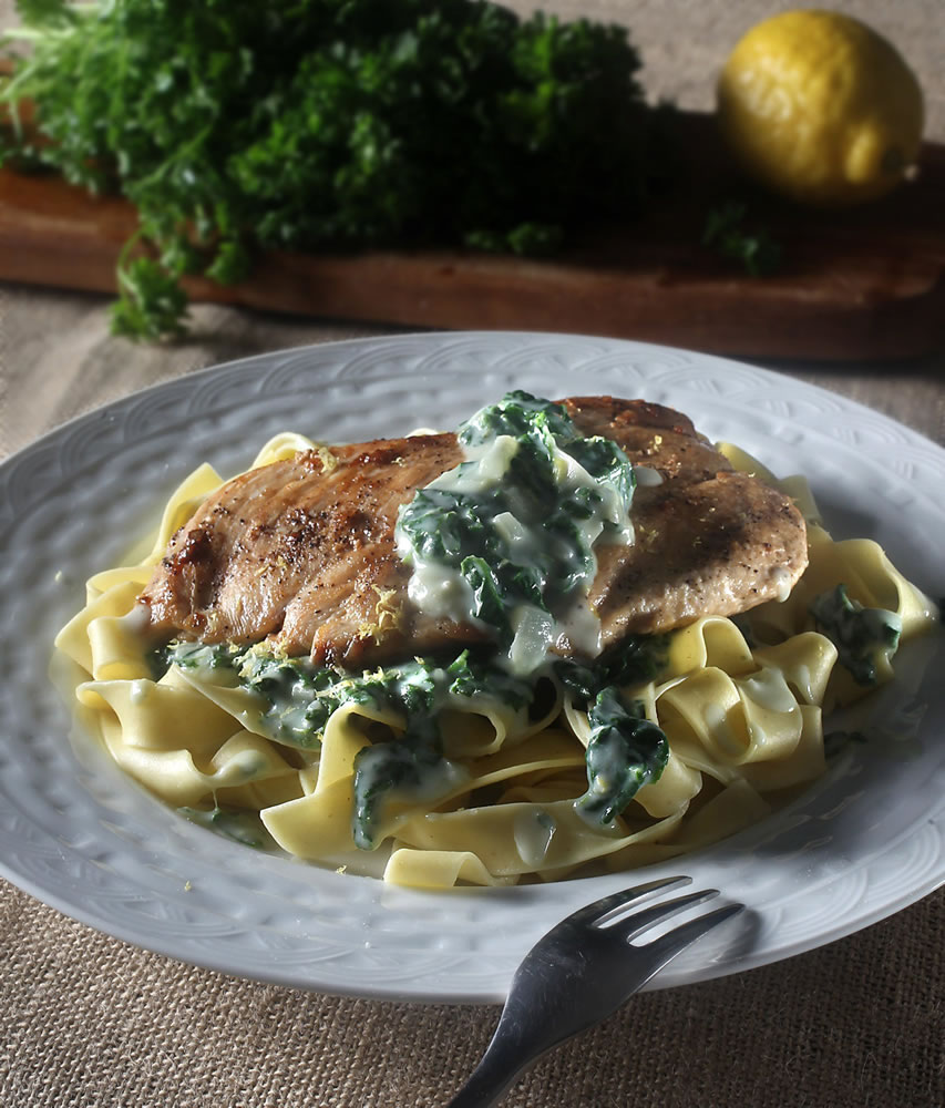 Even though it's still winter, farmers markets are still going and a trip through them can yield a fresh dinner such as this chicken with pappardelle and creamy spinach sauce.