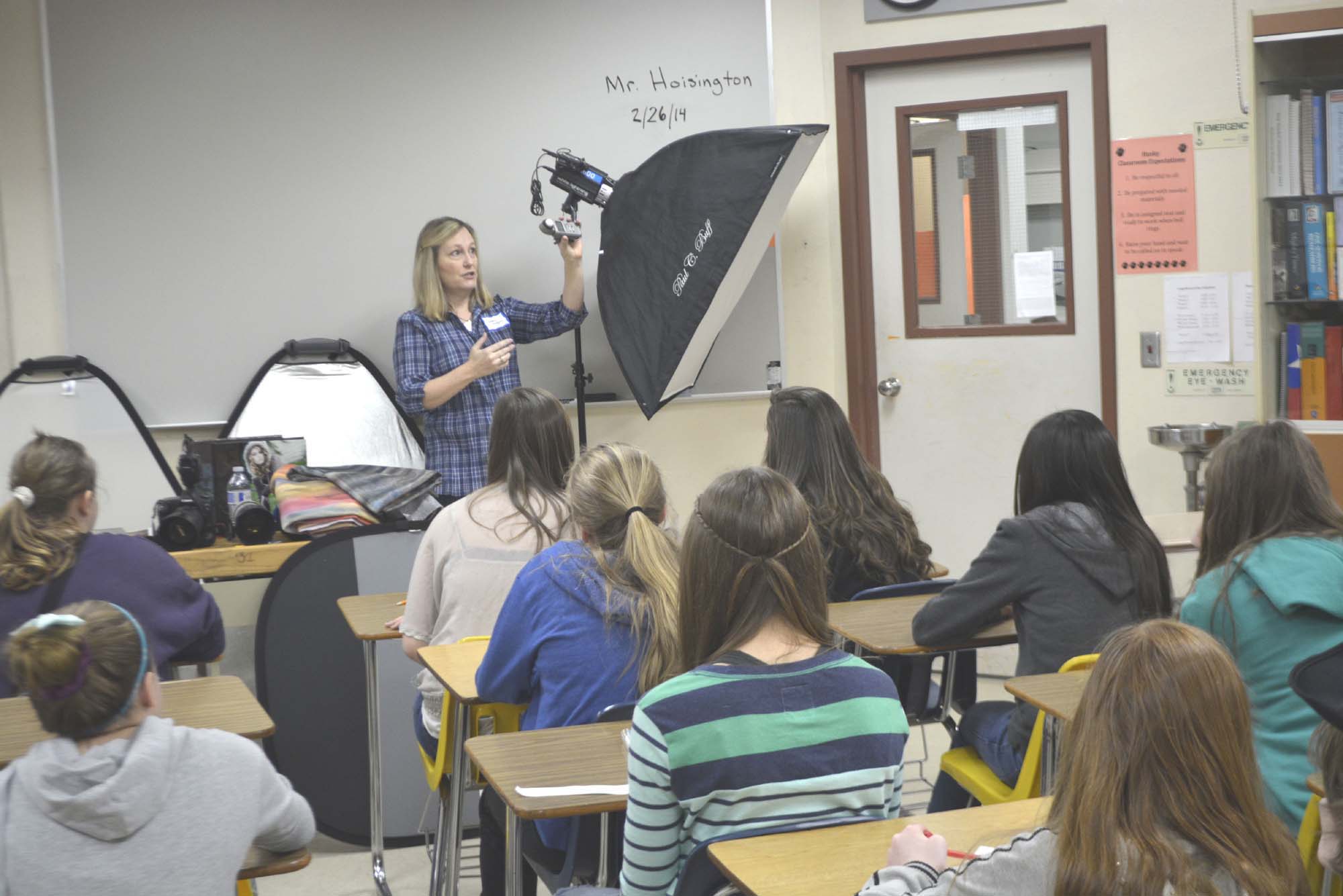 Photographer Debbie Rodgers demonstrates some picture taking techniques during a career fair at Jemtegaard Middle School recently.