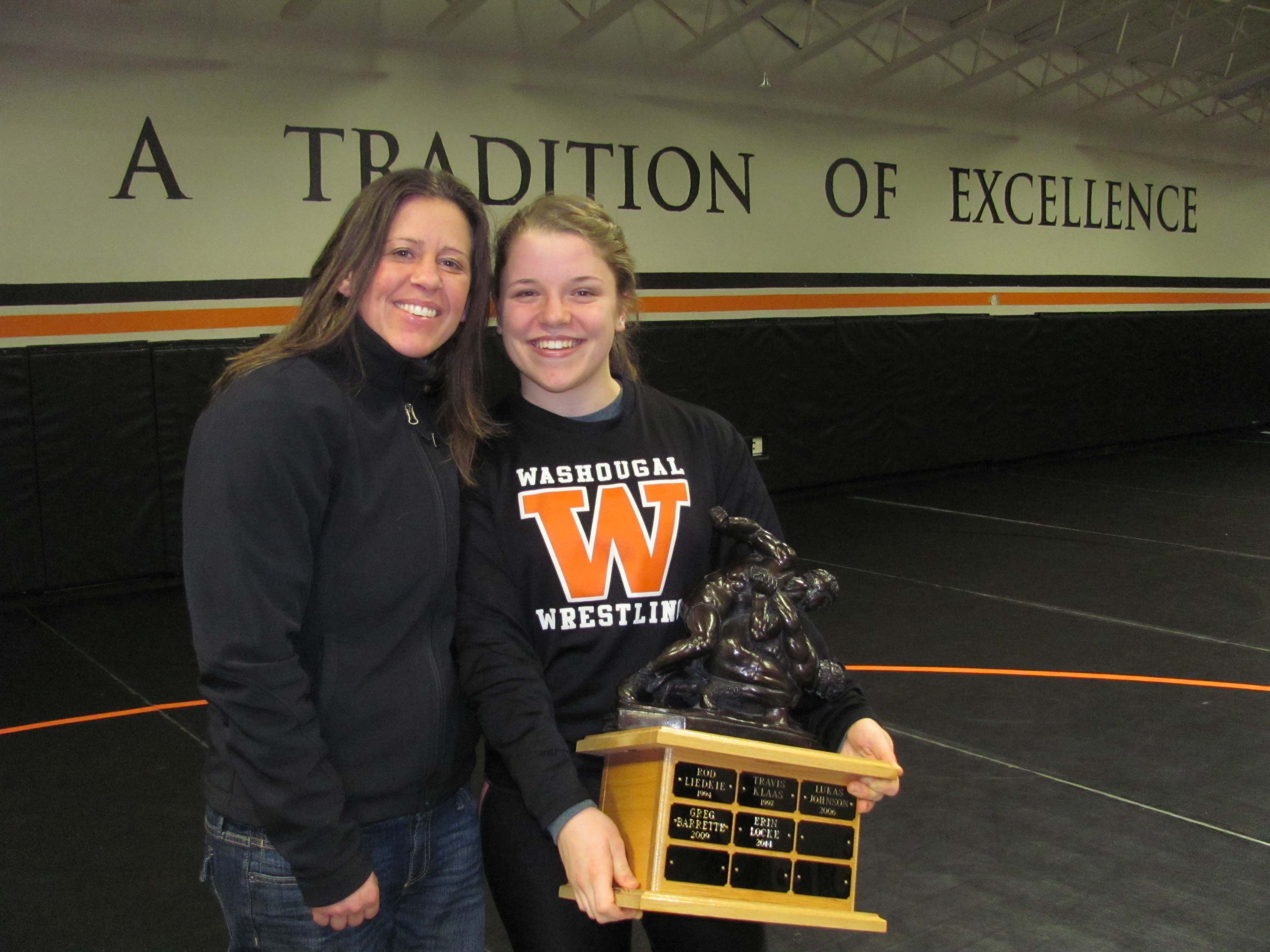 Erin Locke (right) shares a proud moment with coach Heather Carver (left).