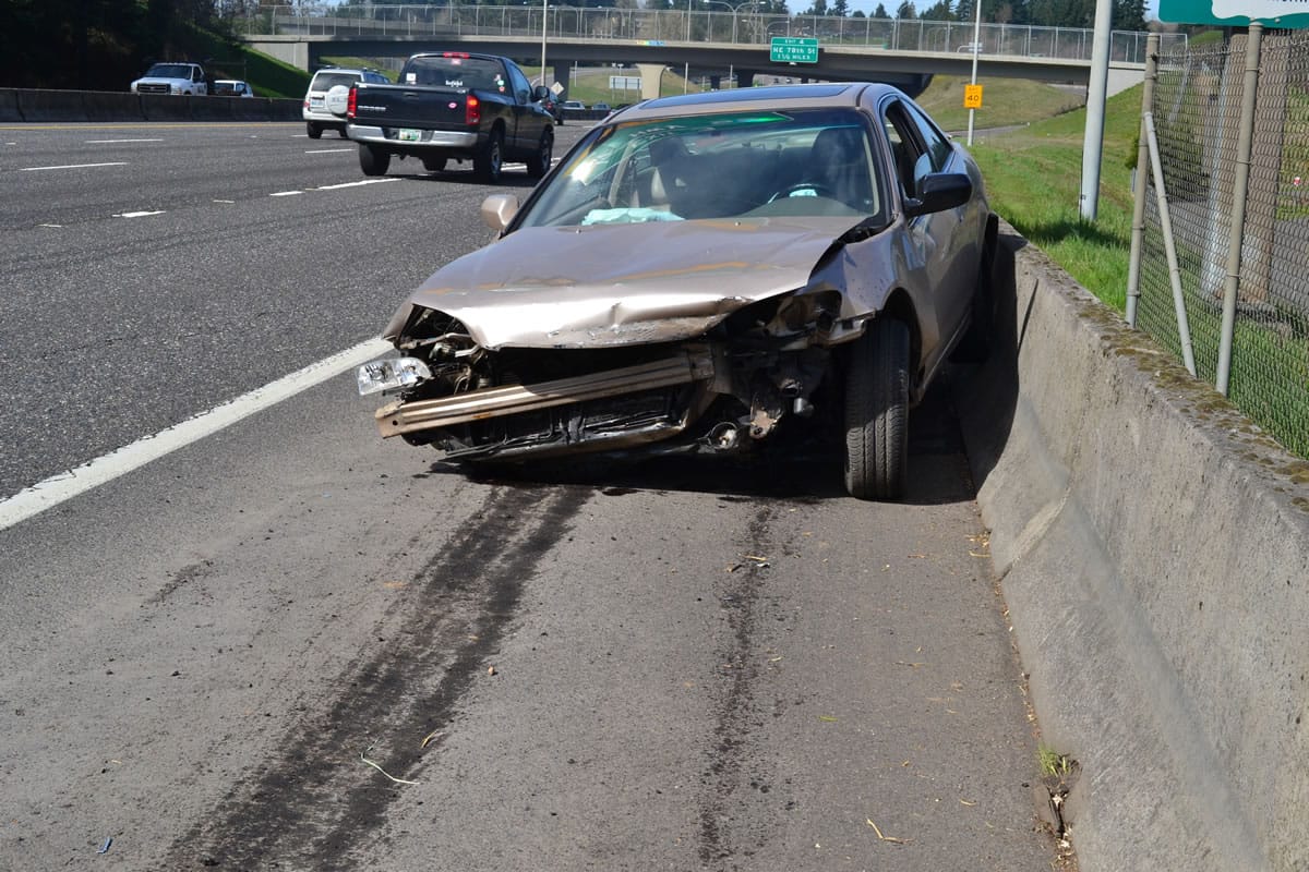 Two teenagers abandoned their car after crashing into a barrier on Interstate 5 northbound just north of Main Street.