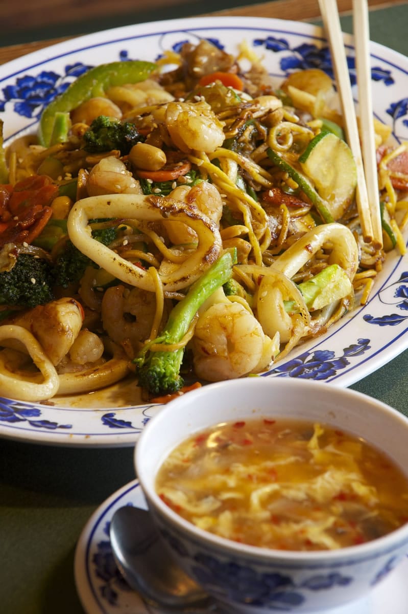 A custom creation at Yummy Mongolian Grill contains noodles, shrimp, calamari and pork with vegetables.