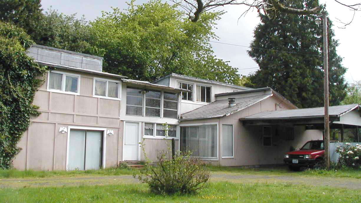 A county tax assessor's photo shows the property at 4201 N.E. 59th Ave.