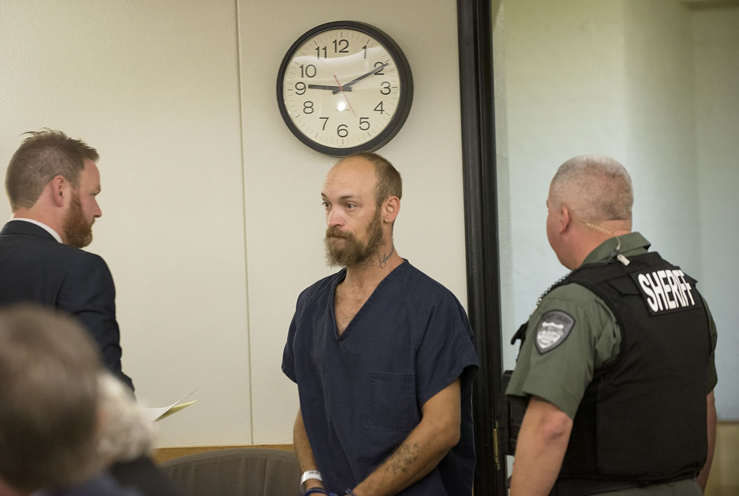 Michael J. Hatch Jr., center, makes a first appearance in September in Clark County Superior Court in connection with a shooting on Sept. 6. He pleaded guilty Monday and was sentenced to nine months.