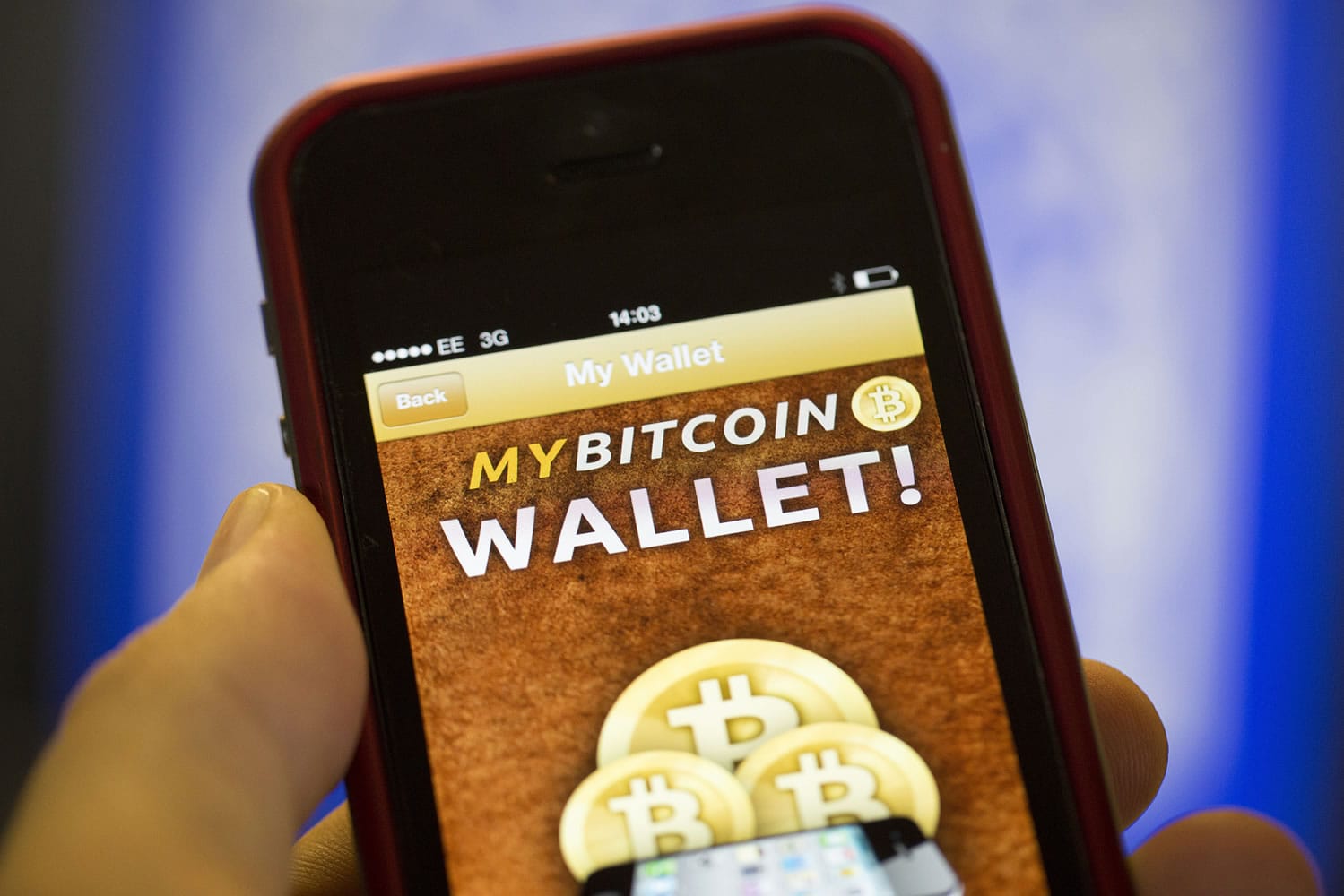 Simon Dawson/Bloomberg News
An iPhone5 displays the Bitcoin Wallet smartphone app. Bitcoin is an online financial network that people use to send payments from one person to another.