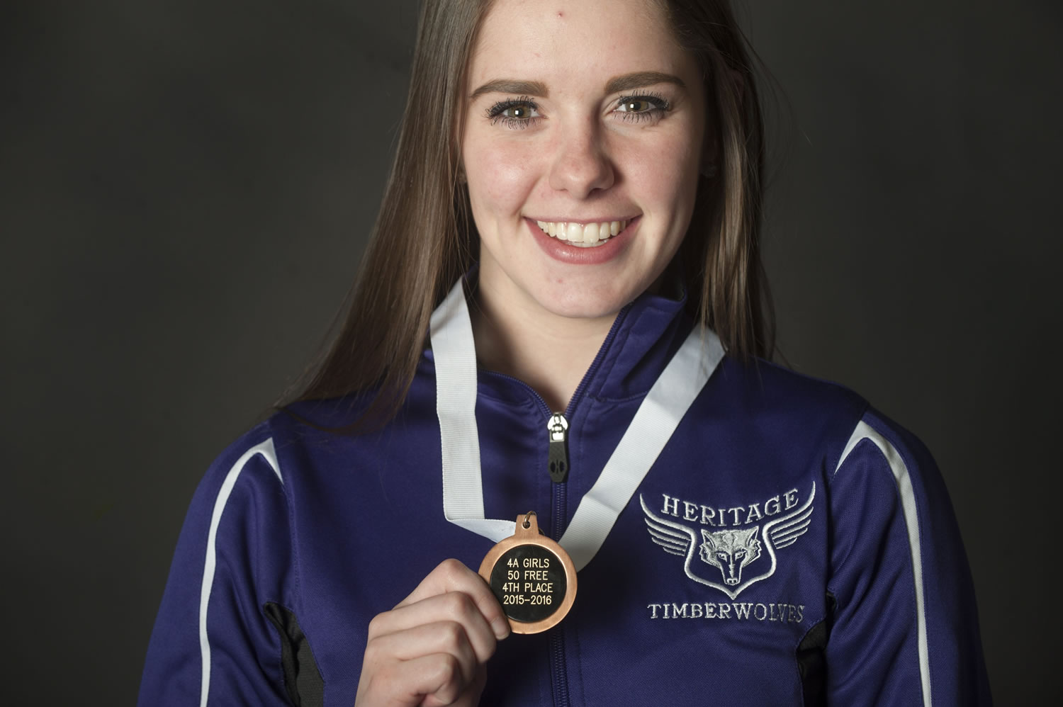 Colleen Woods of Heritage High School, our girls swimmer of the year, shows her medal in Vancouver, Tuesday November 24, 2015.